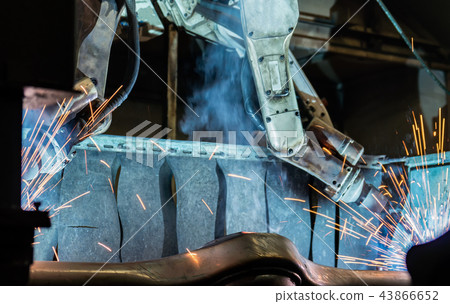 Team industrial robot are welding automotive part Team industrial robot are welding automotive part 43866652
