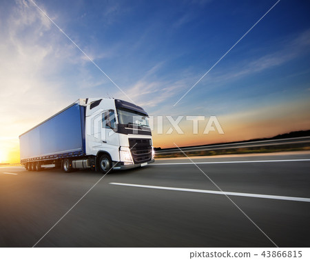 Loaded European truck on motorway in sunset Loaded European truck on motorway in sunset 43866815