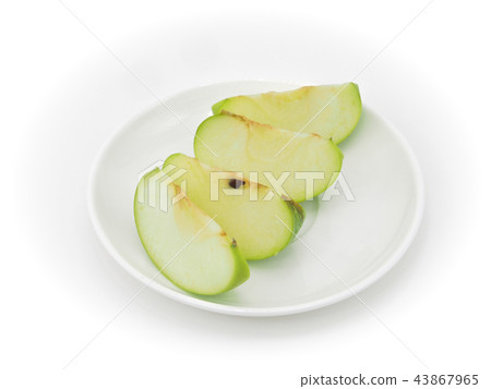 Green apples slice on dish isolated on white Green apples slice on dish isolated on white 43867965