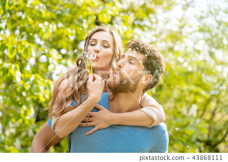 Woman and man on a meadow in romantic mood 43868111