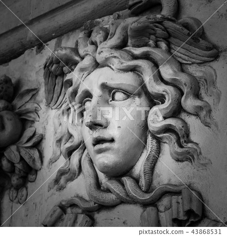 Head with wreath detail of the ancient sculpture Head with wreath detail of the ancient sculpture 43868531