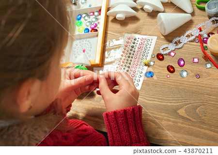 Childrens making decorations for new year holiday Childrens making decorations for new year holiday 43870211