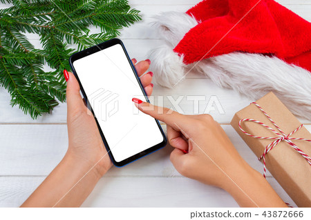 Female buyer makes order at screen of smartphone 43872666