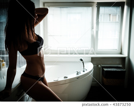 Silhouette of a young woman in lingerie 43873250