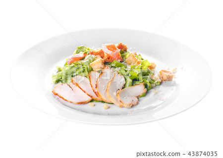 Caesar salad with chicken on plate white isolated 43874035