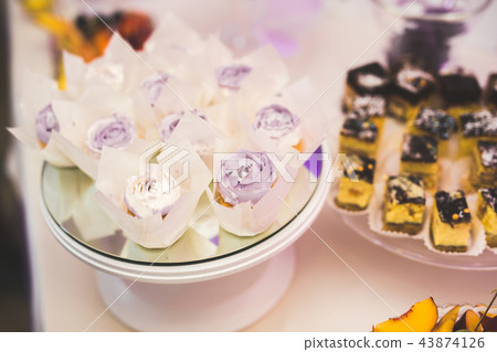 Delicious wedding reception candy bar dessert table Delicious wedding reception candy bar dessert table 43874126