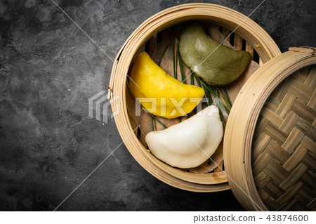 Chuseon day concept, korean thanksgiving day - songpyeon rice cakes on rustic background Chuseon day concept, korean thanksgiving day - songpyeon rice cakes on rustic background 43874600
