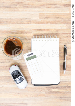 Toy car with notebook, calculator and coffee Toy car with notebook, calculator and coffee 43875281