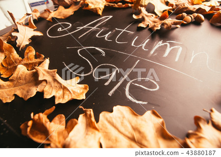 yellow leaves and the inscription autumn  43880187