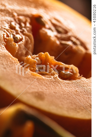 Half of ripe melon close up on blurred background 43880216