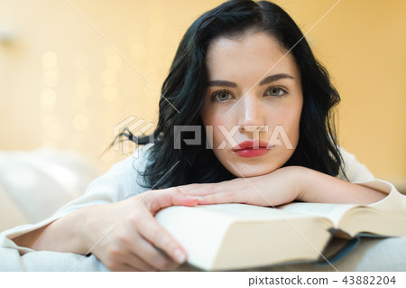 Young woman with a book 43882204