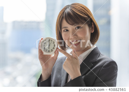 Woman pointing watch 43882561