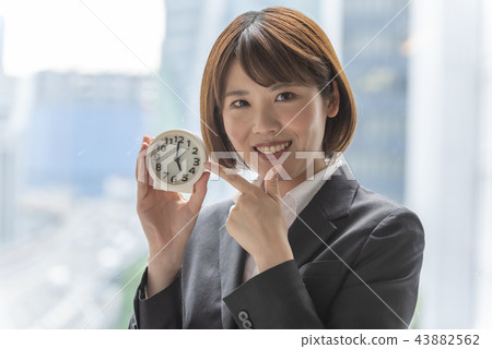 Woman pointing watch 43882562