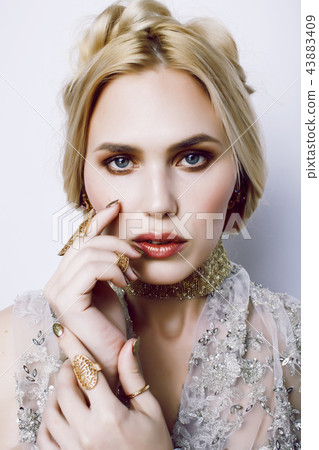young pretty woman with party make up elegant dress on white bac 43883409