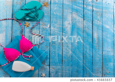 Summer beach accessory on the wood table. Summer beach accessory on the wood table. 43883837