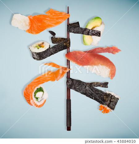 Pieces of delicious japanese sushi frozen in the air. 43884010