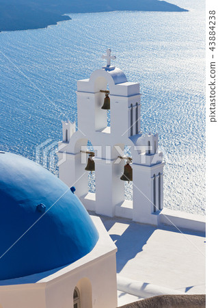 The Three bells of Fira and blue dome, Santorini, Greece. 43884238