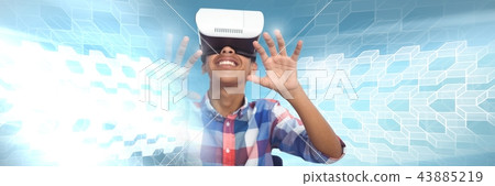 Boy wearing virtual reality headset with geometric transitions Boy wearing virtual reality headset with geometric transitions 43885219