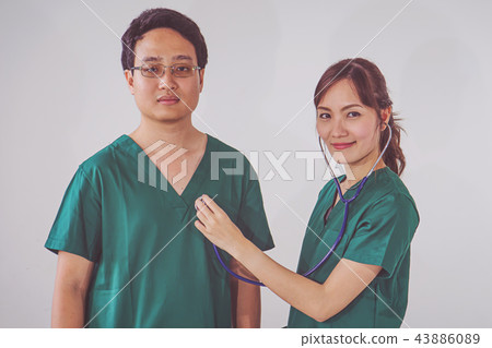 doctor with stethoscope examining heart doctor with stethoscope examining heart 43886089