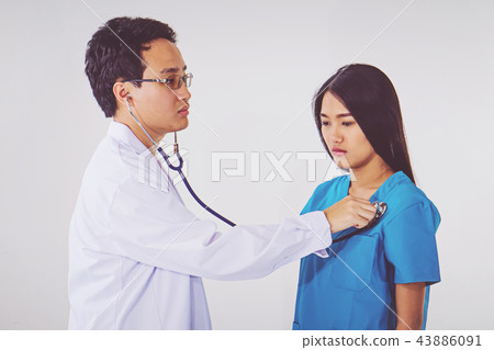 doctor with stethoscope examining heart doctor with stethoscope examining heart 43886091