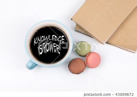 knowledge is power. coffee mug and macarons knowledge is power. coffee mug and macarons 43889672