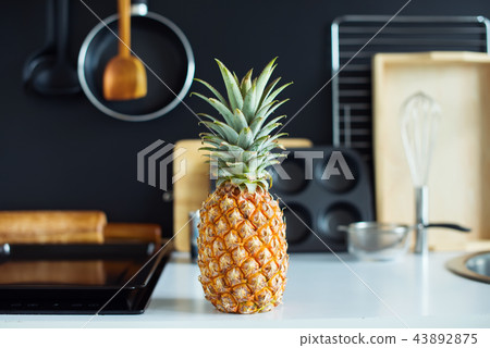 Pine Apple Tropical Fruit on Kitchen Table Preparation 43892875