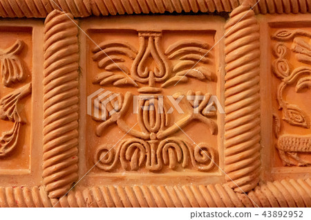 Traditional russian ornament on clay oven tiles 43892952