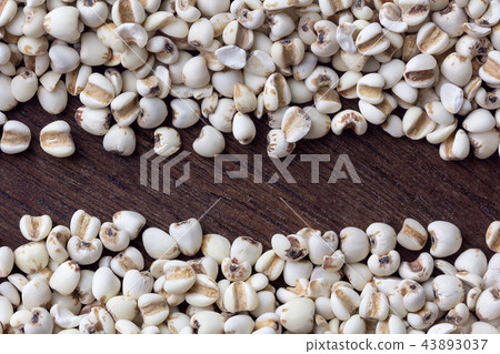 close up millet grain on wooden table background. close up millet grain on wooden table background. 43893037
