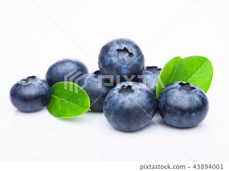 Fresh raw organic blueberries with leaf on white 43894001