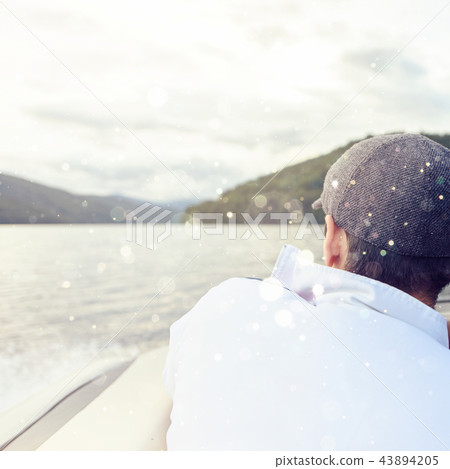 Man with gray cap looking to mountains Man with gray cap looking to mountains 43894205