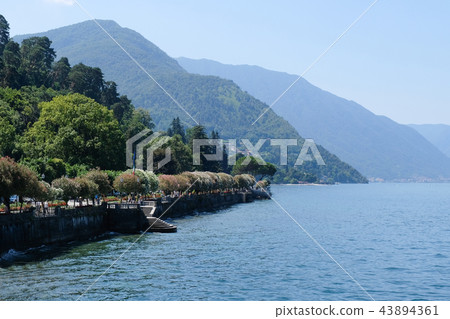 Lake Como in a sunny day with shore on side Lake Como in a sunny day with shore on side 43894361