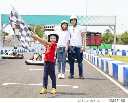 happy family standing on the go kart race track 43897468