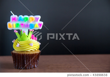 Cup cake and happy birthday text candle  on  cupca 43898638