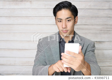 Men with smartphones Men with smartphones 43898711