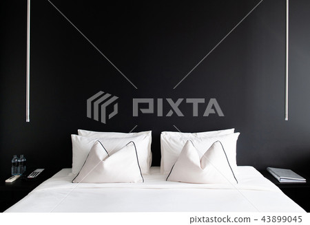 Modern Bedroom with black wall white bed, pillows 43899045