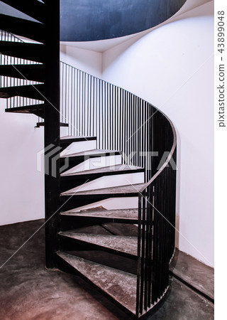 Industrial loft spiral stair with concrete floor 43899048