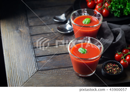 Tomato soup on wooden table Tomato soup on wooden table 43900057