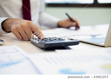Male accountant or banker calculate the cash bill. 43901057