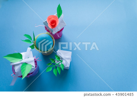 easter, blue egg and white gift with paper flower easter, blue egg and white gift with paper flower 43901485