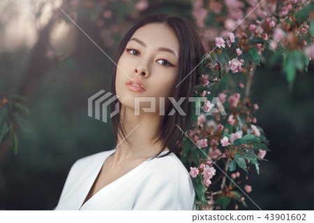 Asian woman fashion close-up portrait outdoors 43901602