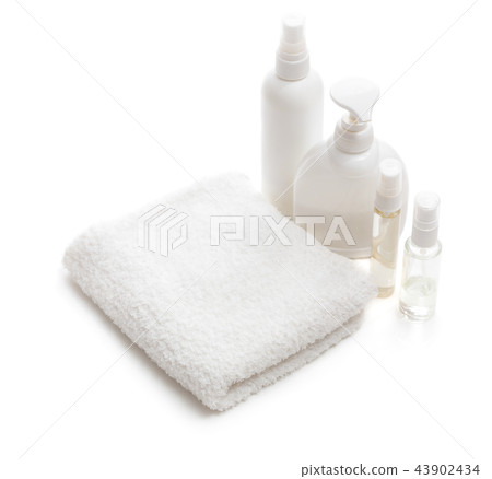 White towel and bottles with cosmetics 43902434