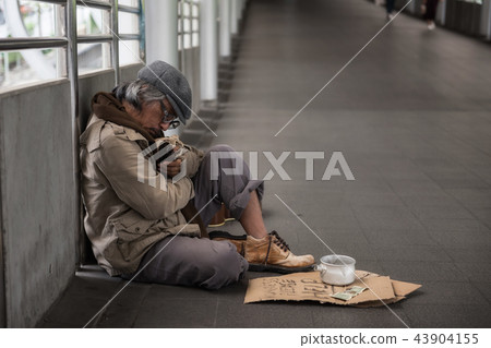 Homeless sleep and hold beer bottle Homeless sleep and hold beer bottle 43904155