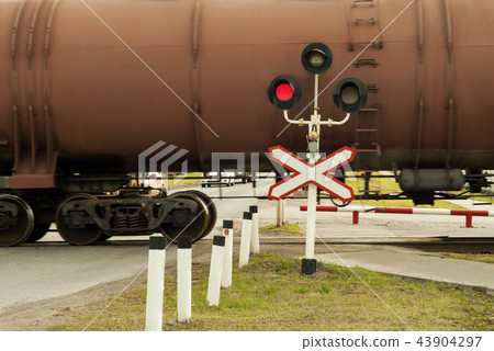 traffic light and sign at the railway crossing traffic light and sign at the railway crossing 43904297
