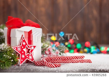 Christmas gift box, candy canes and tree Christmas gift box, candy canes and tree 43905268