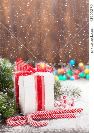 Christmas gift box, candy canes and tree Christmas gift box, candy canes and tree 43905270