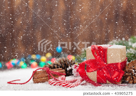 Christmas gift box, candy canes and tree Christmas gift box, candy canes and tree 43905275