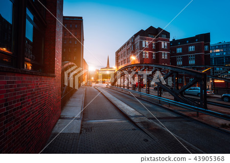 Empty Poggenmuehlen Bridge at twilight. Hamburg, Germany. illuminated buildings and last sunrays 43905368
