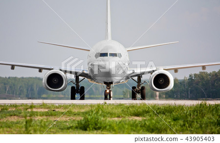 Front view of plane before takeoff 43905403