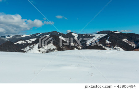 Cross on winter mountain hill top Cross on winter mountain hill top 43906494
