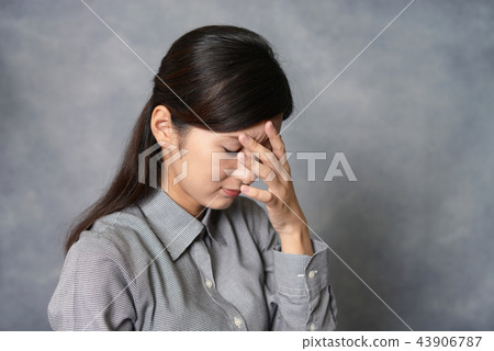 A woman with a depressed face A woman with a depressed face 43906787